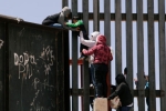 punjabis crossing mexico border, punjabis crossing US mexico border, video clip shows punjabi women children crossing border fence into u s, Punjabis