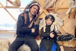 shah rukh khan net worth, Shah Rukh Khan trolled, shah rukh khan and his son abram trolled for sporting native american war bonnets, Abram